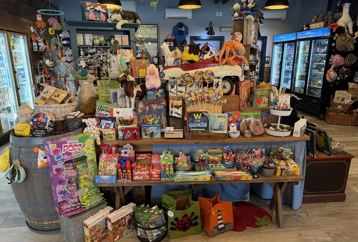 A table piled with candy, kids' books, stuffed animals and Washington souvenirs