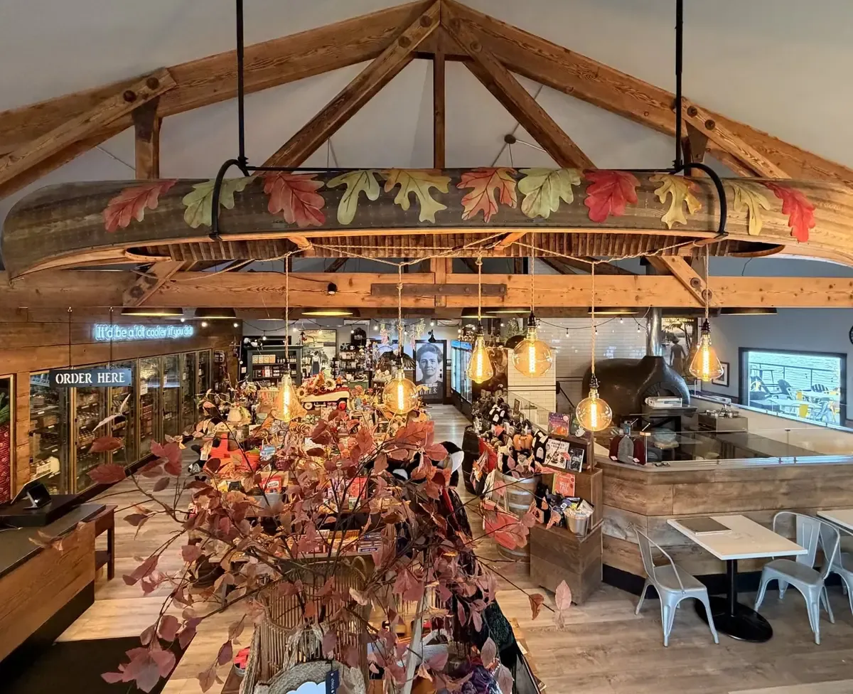 Inside the market: timber trusses, a canoe chandelier, gift tables and the pizza oven